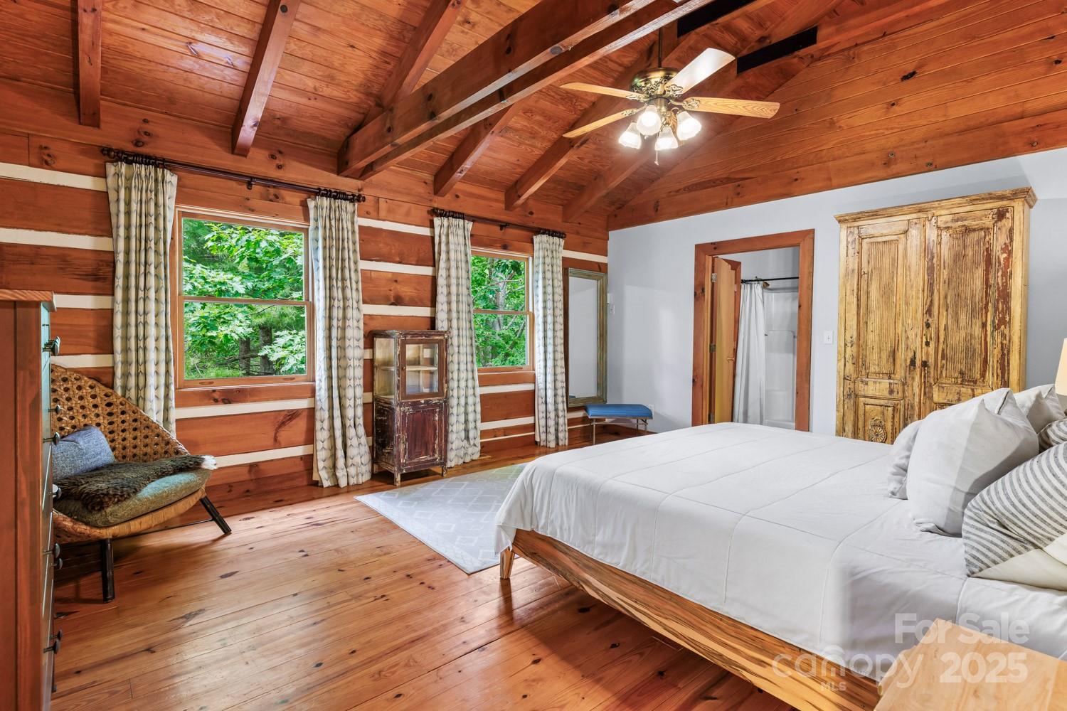 1745 Sugar Camp Road Marshall, NC 28753 - Photo 19 of 41 a bed sitting in a bedroom next to a window