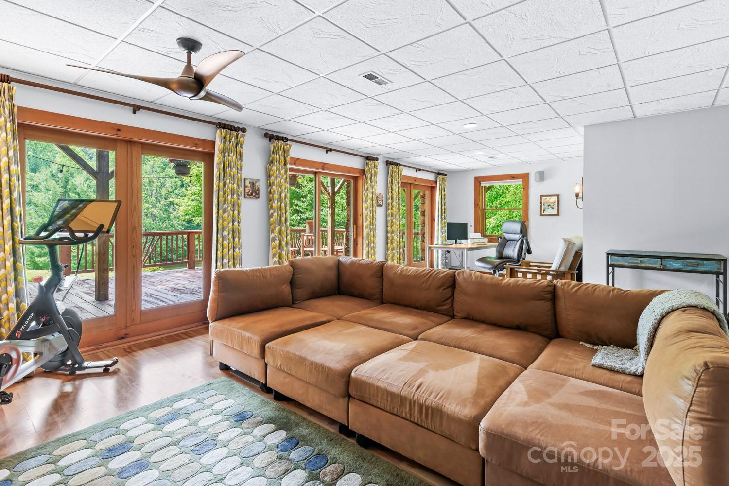 1745 Sugar Camp Road Marshall, NC 28753 - Photo 21 of 41 a living room with furniture and a large window