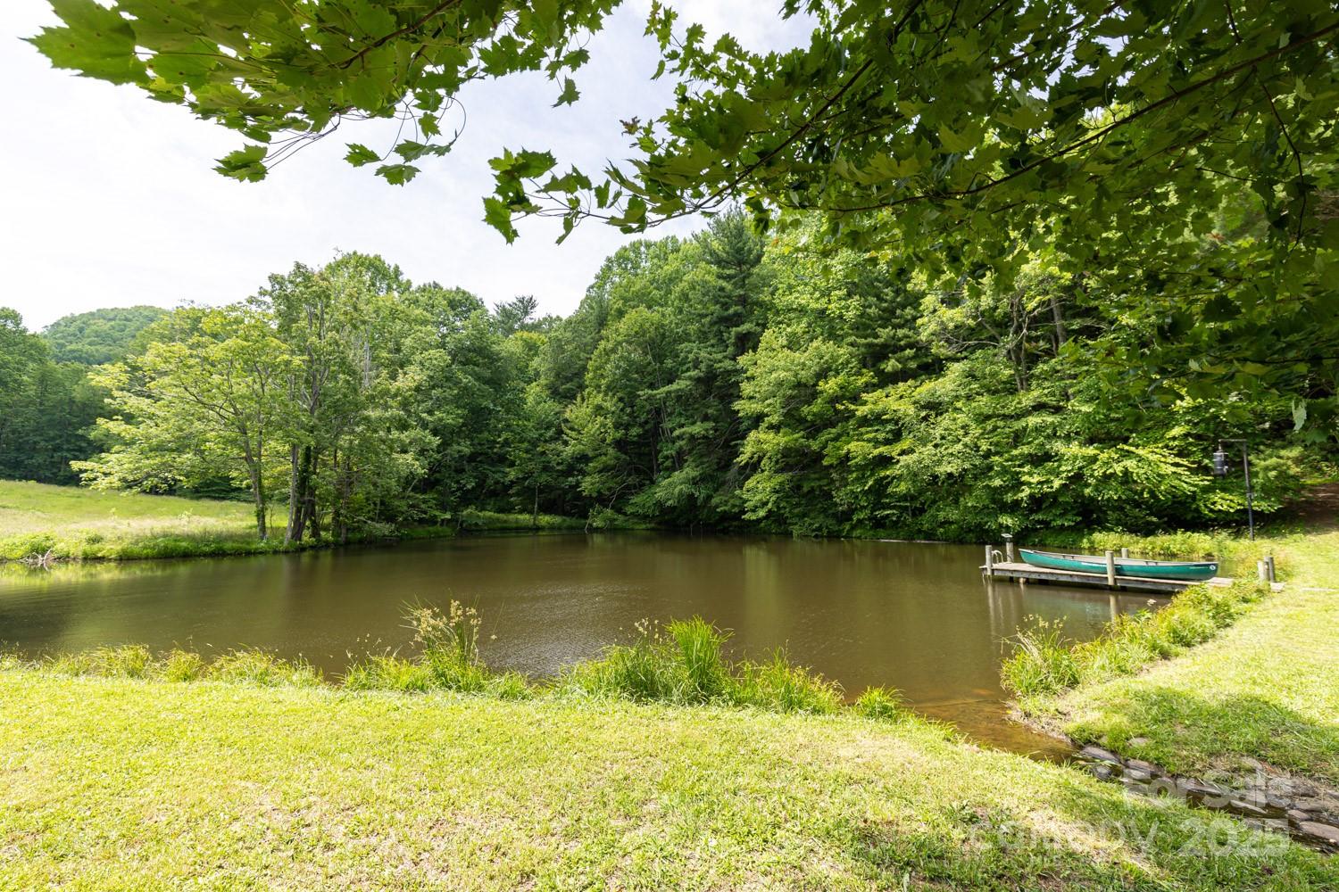 1745 Sugar Camp Road Marshall, NC 28753 - Photo 26 of 41 an aerial view of a houses with a lake view