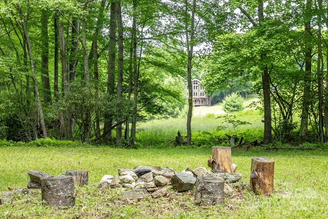 a view of a lake with a table and chairs