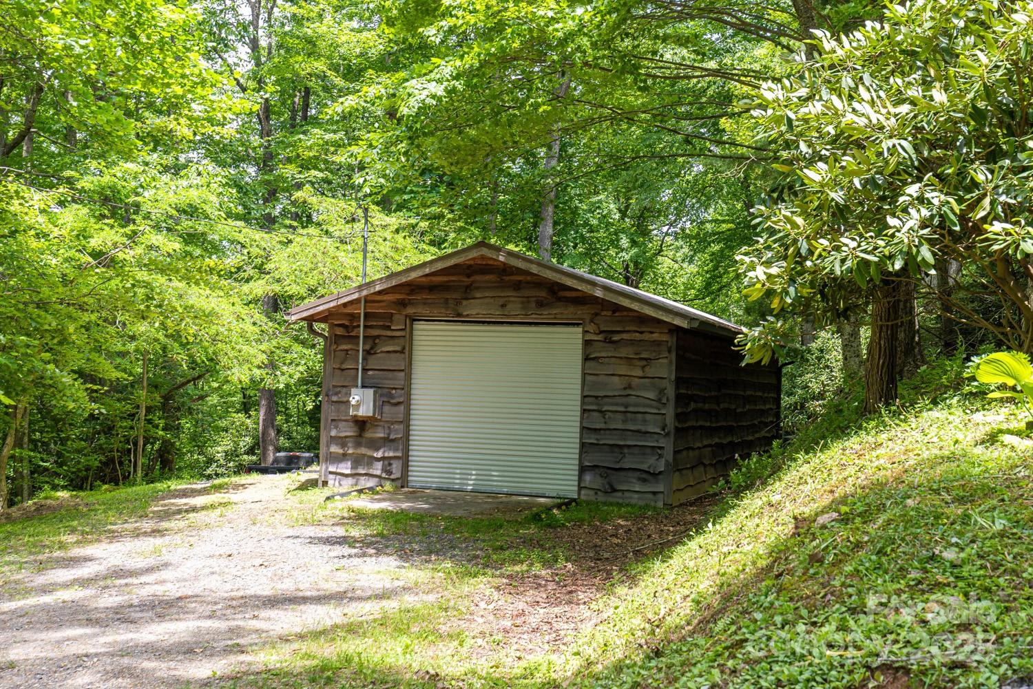 1745 Sugar Camp Road Marshall, NC 28753 - Photo 39 of 41 a view of a house with a yard and garage