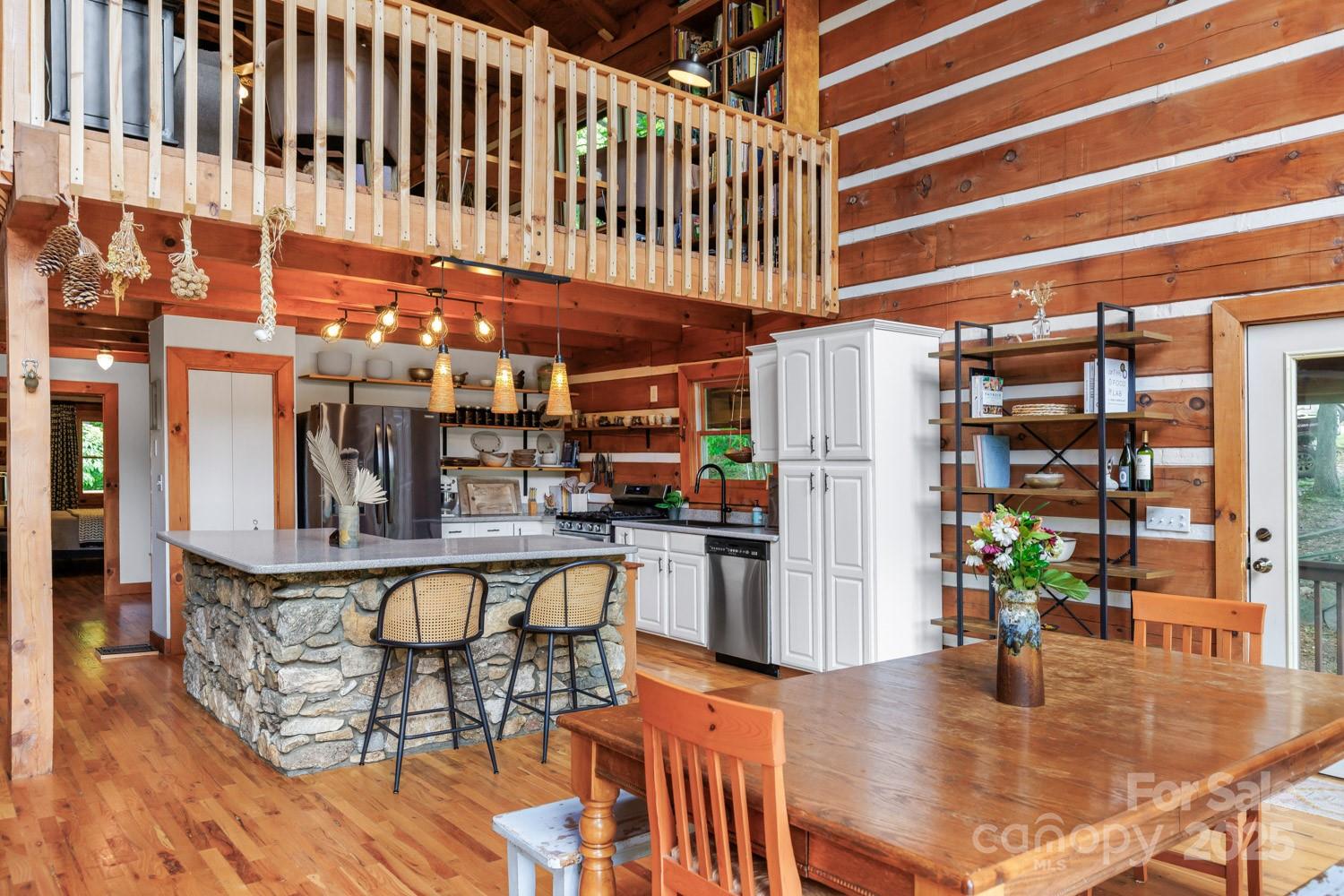 1745 Sugar Camp Road Marshall, NC 28753 - Photo 7 of 41 a kitchen with stainless steel appliances granite countertop a refrigerator and a stove top oven