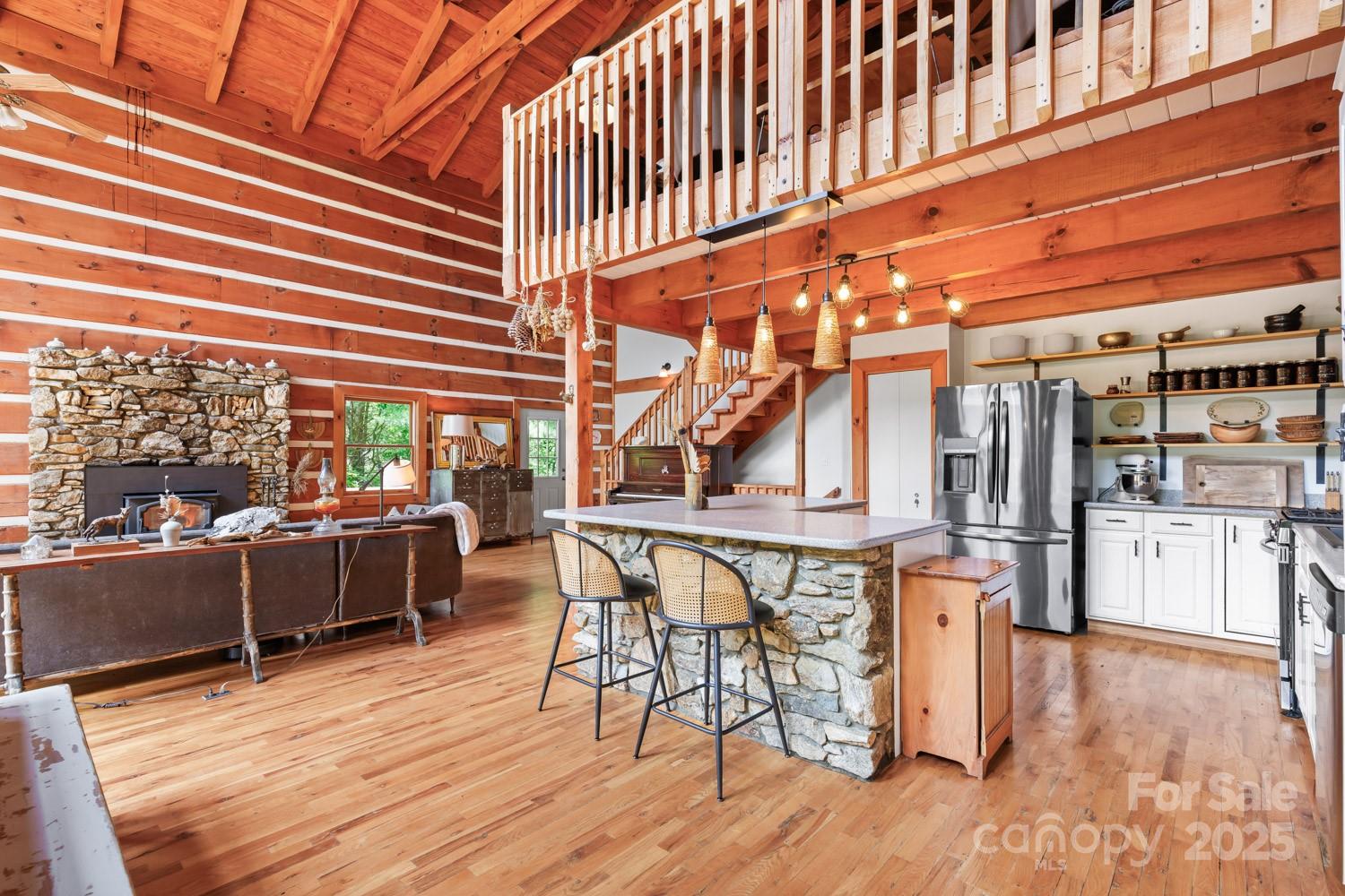1745 Sugar Camp Road Marshall, NC 28753 - Photo 8 of 41 a view of a patio with table and chairs