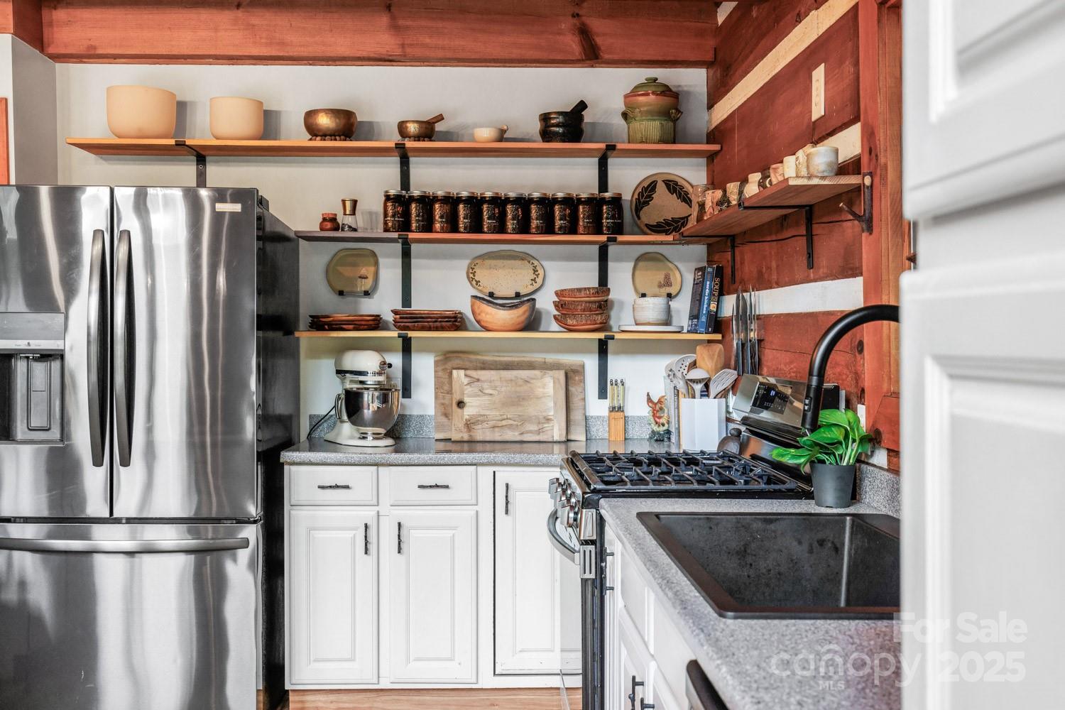 1745 Sugar Camp Road Marshall, NC 28753 - Photo 9 of 41 a kitchen with stainless steel appliances granite countertop a stove and a refrigerator