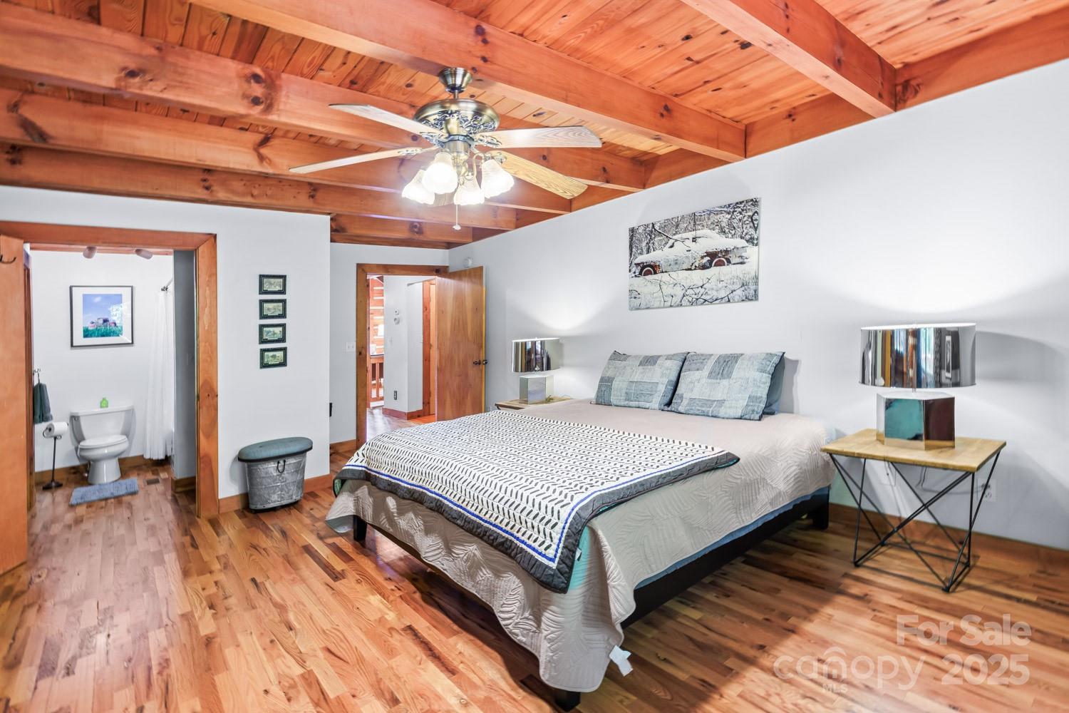 1745 Sugar Camp Road Marshall, NC 28753 - Photo 10 of 41 a spacious bedroom with a bed and a table