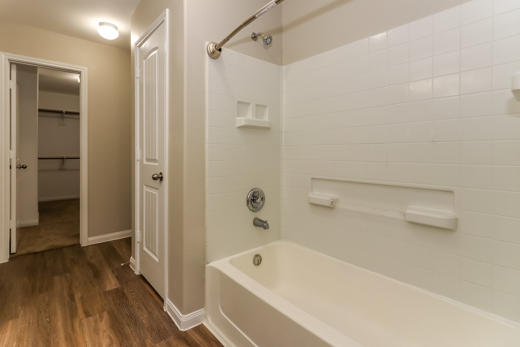 10311 Urban Oak Trail Houston, TX 77044 - Photo 12 of 15 a bathroom with a tub shower and vanity
