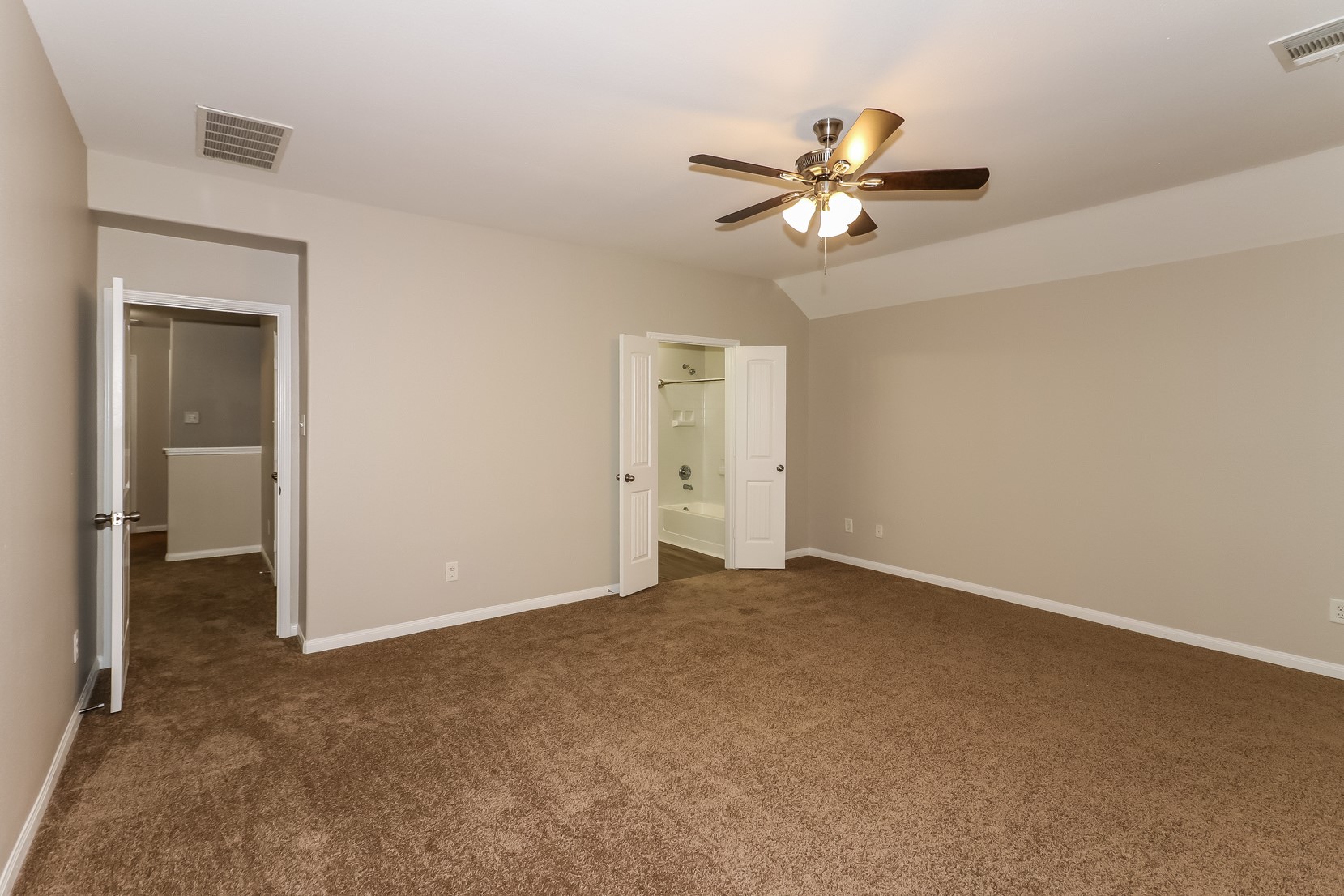 10311 Urban Oak Trail Houston, TX 77044 - Photo 8 of 15 a view of a chandelier fan and a ceiling fan