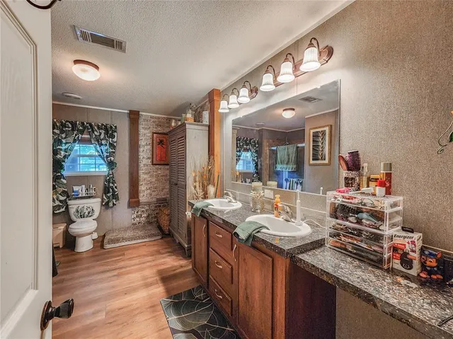 a bathroom with a sink double vanity and a mirror