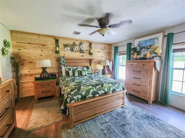 a bed room with a bed and a window