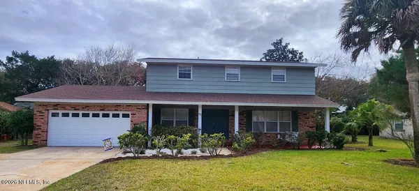 front view of a house with a yard