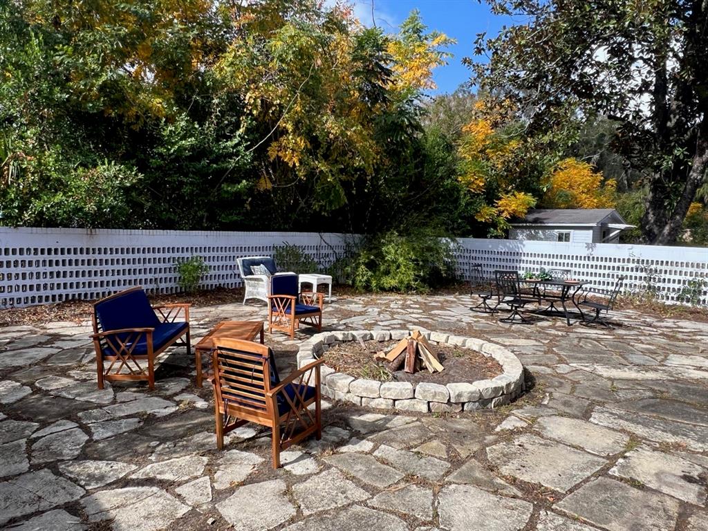 108 Northwest 2nd Street Williston, FL 32696 - Photo 42 of 45 a view of swimming pool with chairs and tables