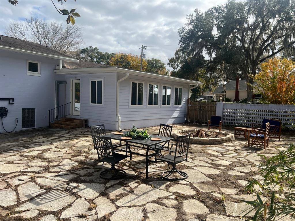 108 Northwest 2nd Street Williston, FL 32696 - Photo 44 of 45 a row of table and chairs in patio of a house