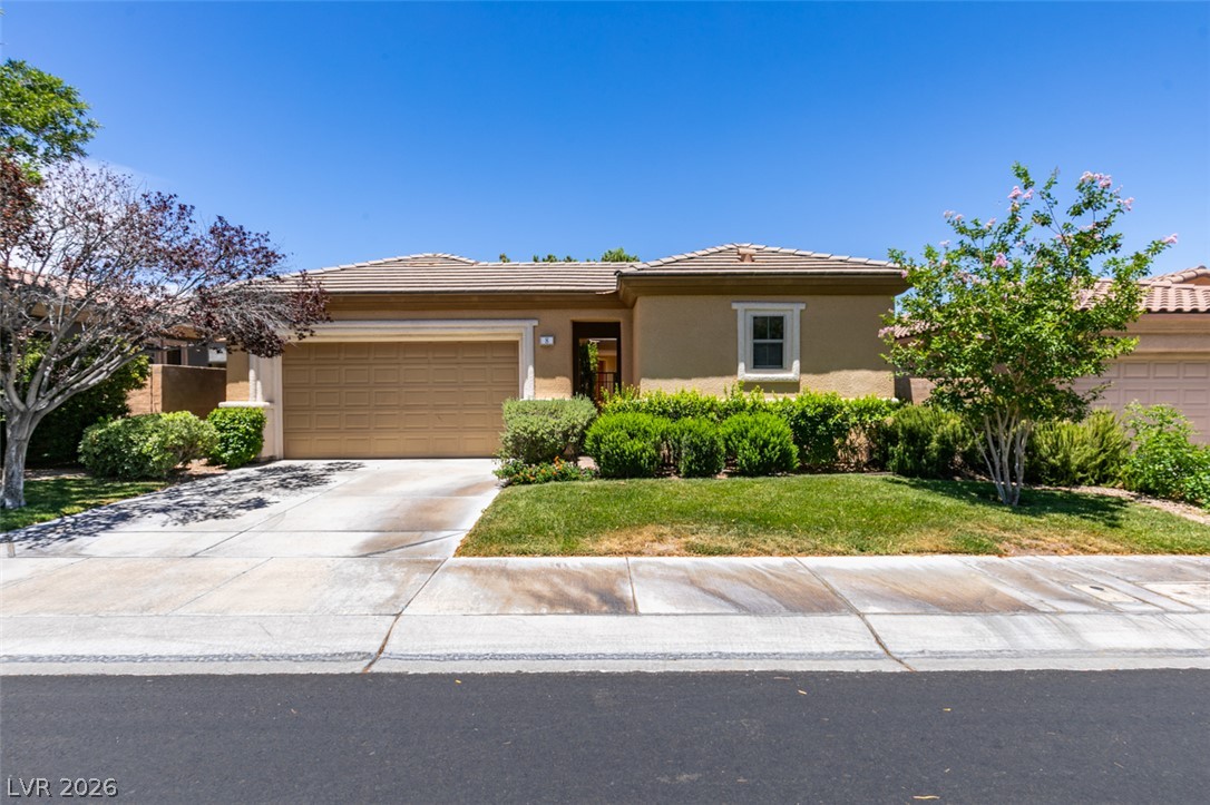 8 Kennesaw Road Henderson, NV 89052 - Photo 1 of 44 A well-kept front yard and paved driveway complement this charming single-story residence.