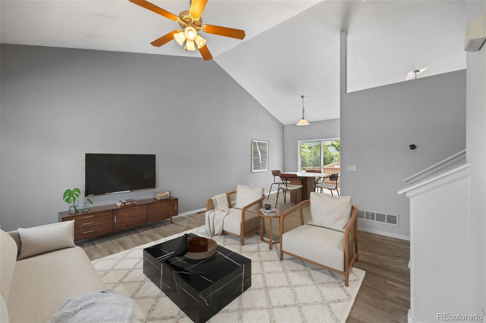 a living room with furniture and a flat screen tv