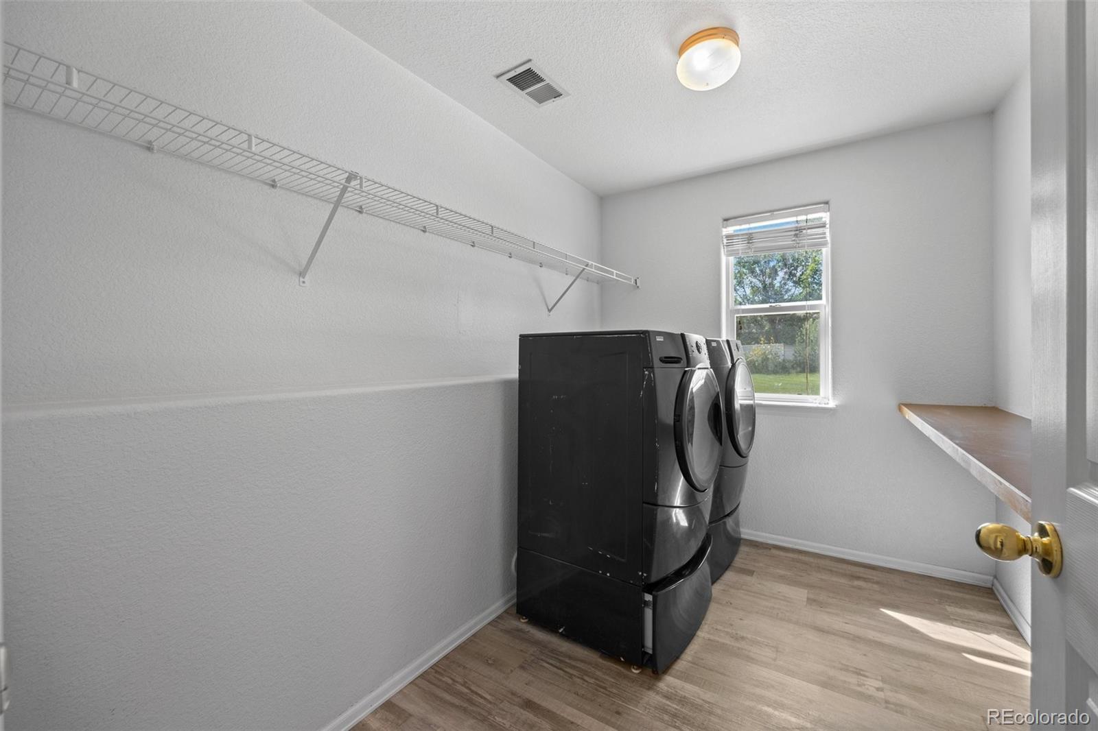 5328 Rustic Avenue Firestone, CO 80504 - Photo 16 of 22 a view of walk in closet with window and entryway