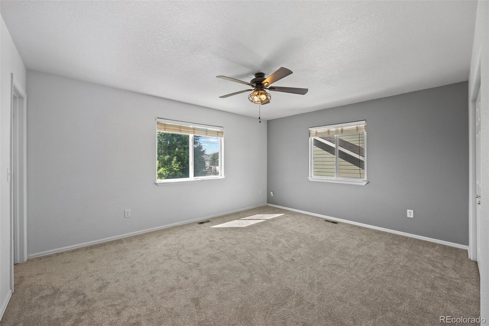 5328 Rustic Avenue Firestone, CO 80504 - Photo 9 of 22 a view of an empty room with a window