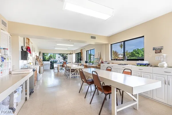a view of a dining room with furniture window and outside view