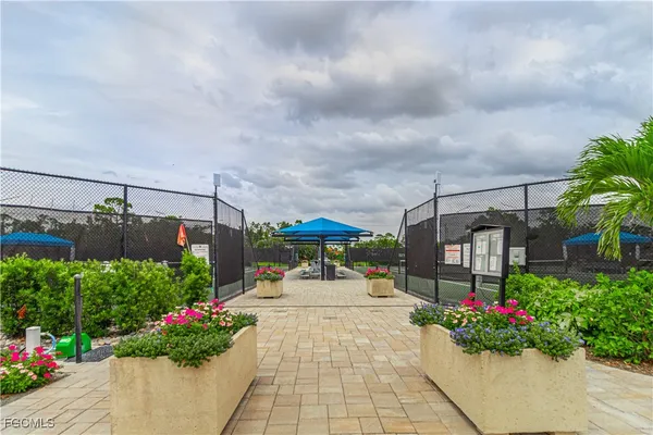 a large kitchen with a table and chairs