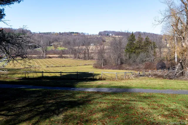 a view of a swimming pool with a yard