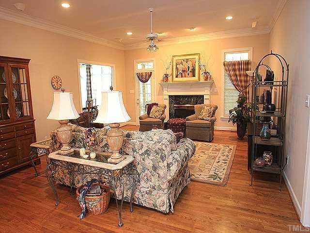 6509 Arbor Grande Way Raleigh, NC 27615 - Photo 2 of 12 Great room with gas logs, hardwood floors, recessed lighting, crown moldings