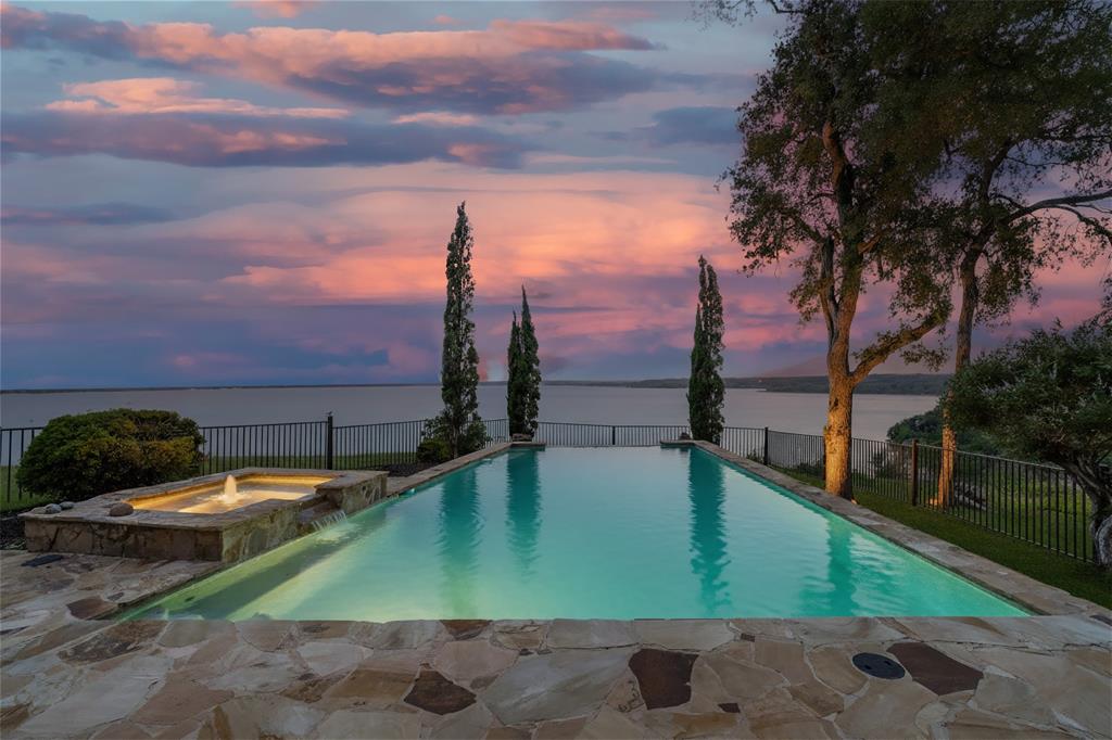 1237 Overlook Court Whitney, TX 76692 - Photo 20 of 20 a view of a swimming pool with a lounge chairs