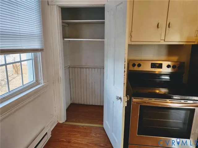 a kitchen with a stove and a refrigerator