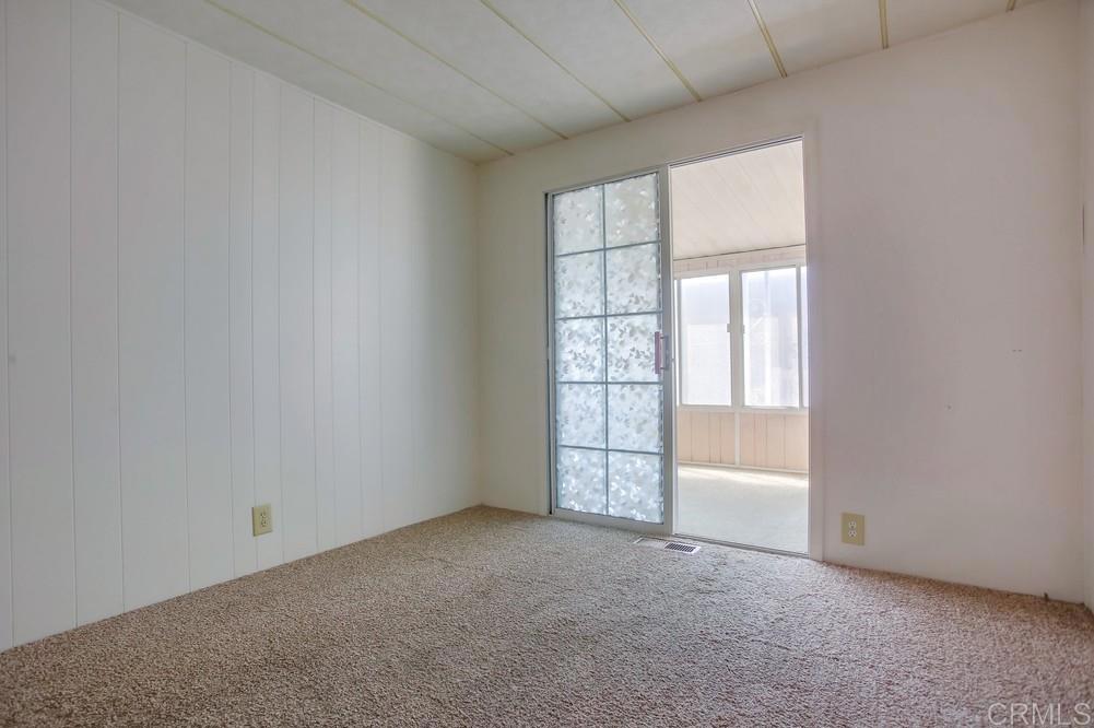 1506 Oak Drive, Unit 22 Vista, CA 92084 - Photo 27 of 58 a view of an empty room with a window