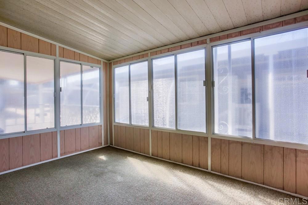 1506 Oak Drive, Unit 22 Vista, CA 92084 - Photo 32 of 58 a view of an empty room with a window
