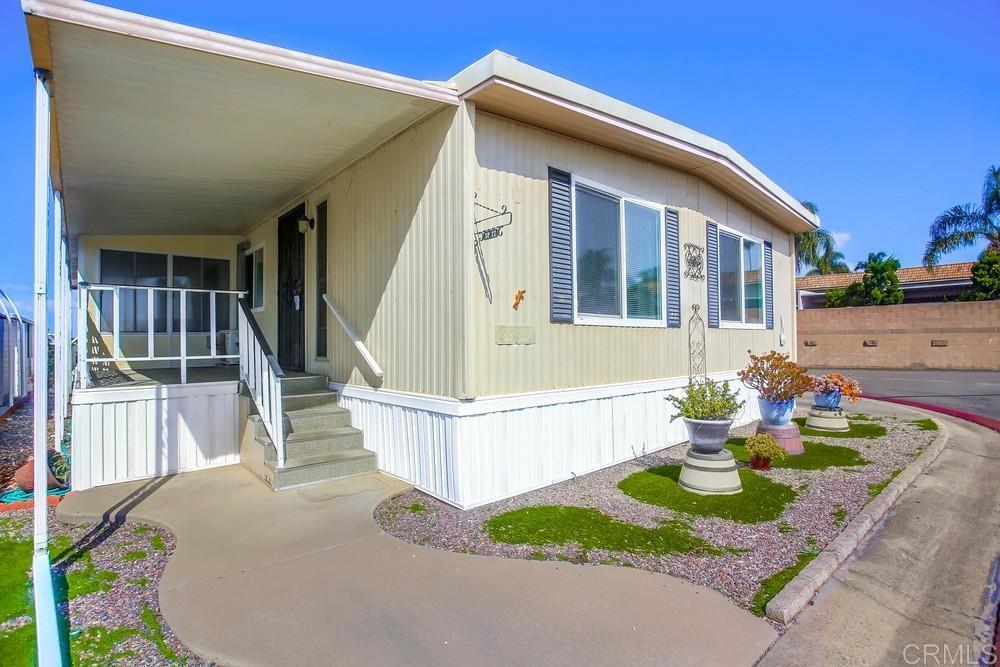 1506 Oak Drive, Unit 22 Vista, CA 92084 - Photo 4 of 58 a front view of a house with a yard