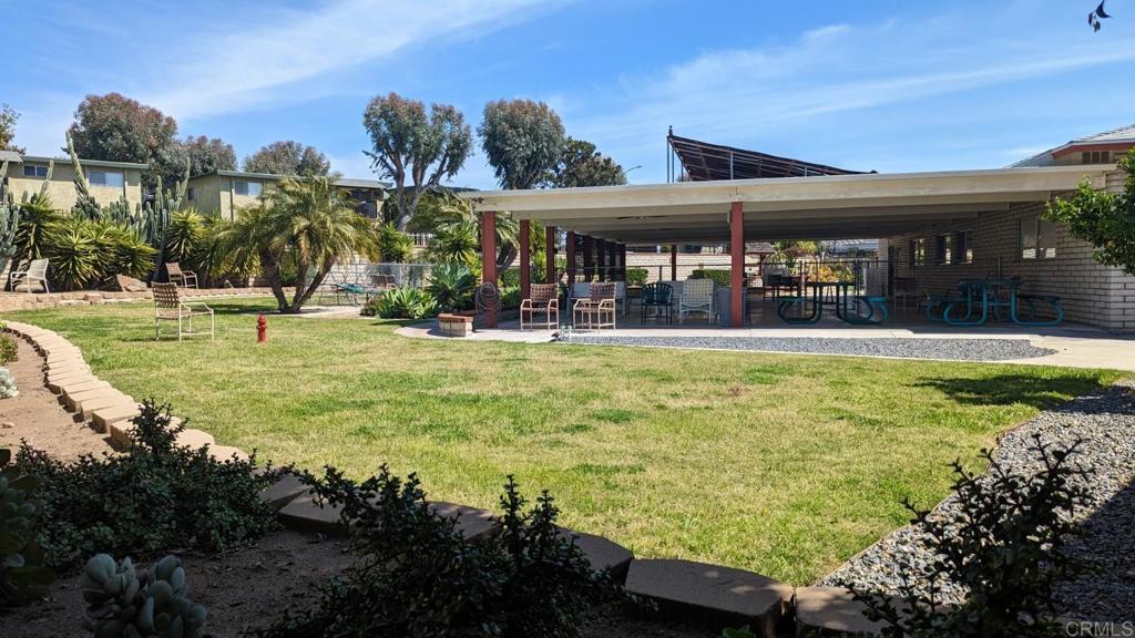 1506 Oak Drive, Unit 22 Vista, CA 92084 - Photo 56 of 58 a view of a swimming pool with an outdoor seating