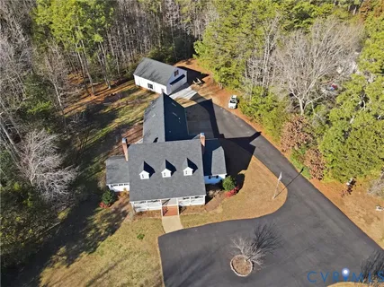 an aerial view of a house with swimming pool