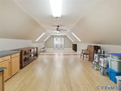 a room with lots of furniture and wooden floors