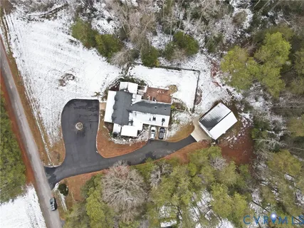 an aerial view of a house with outdoor space