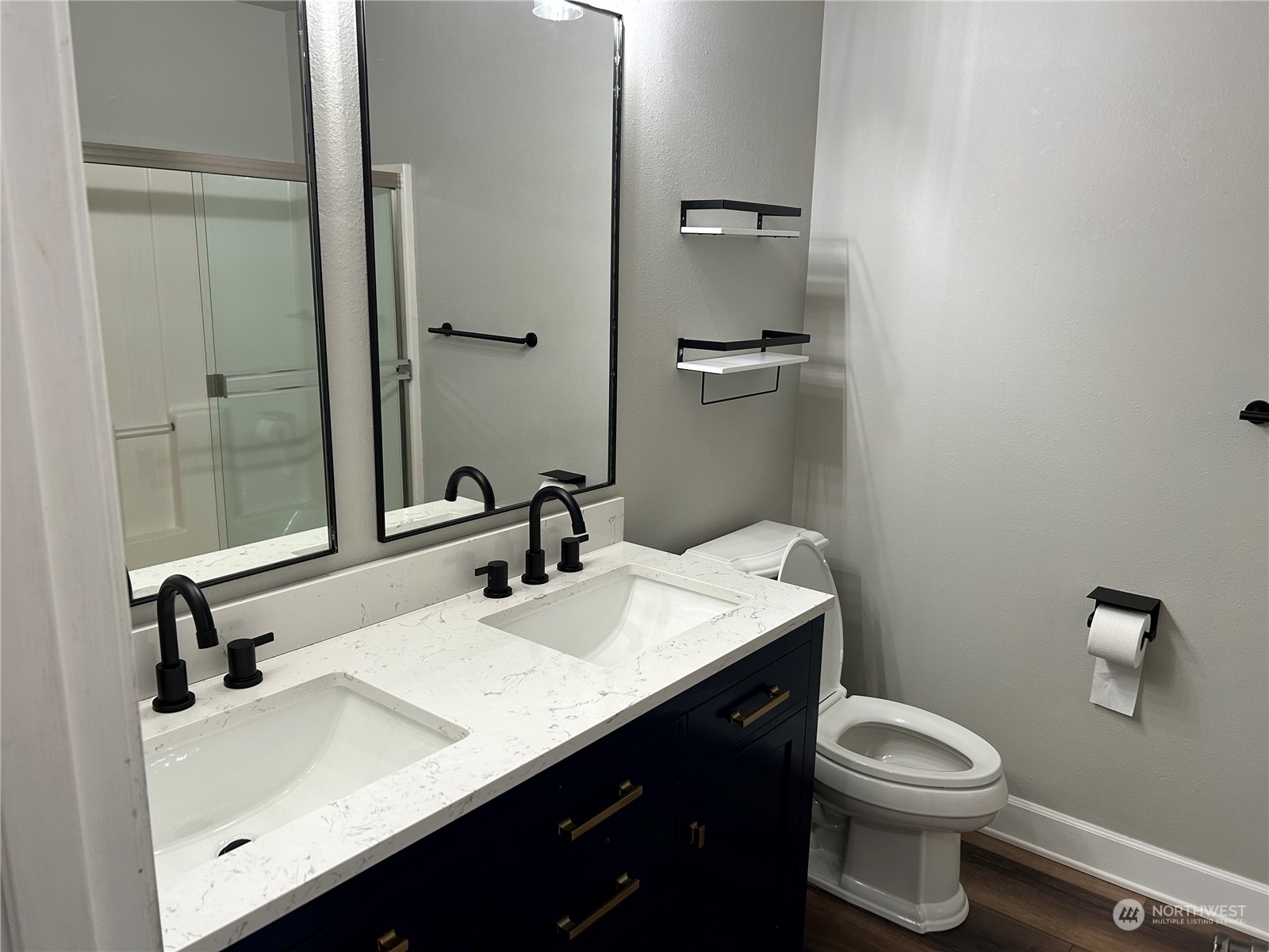 18835 Southeast Petrovitsky Road Renton, WA 98058 - Photo 13 of 34 a bathroom with a sink toilet and vanity
