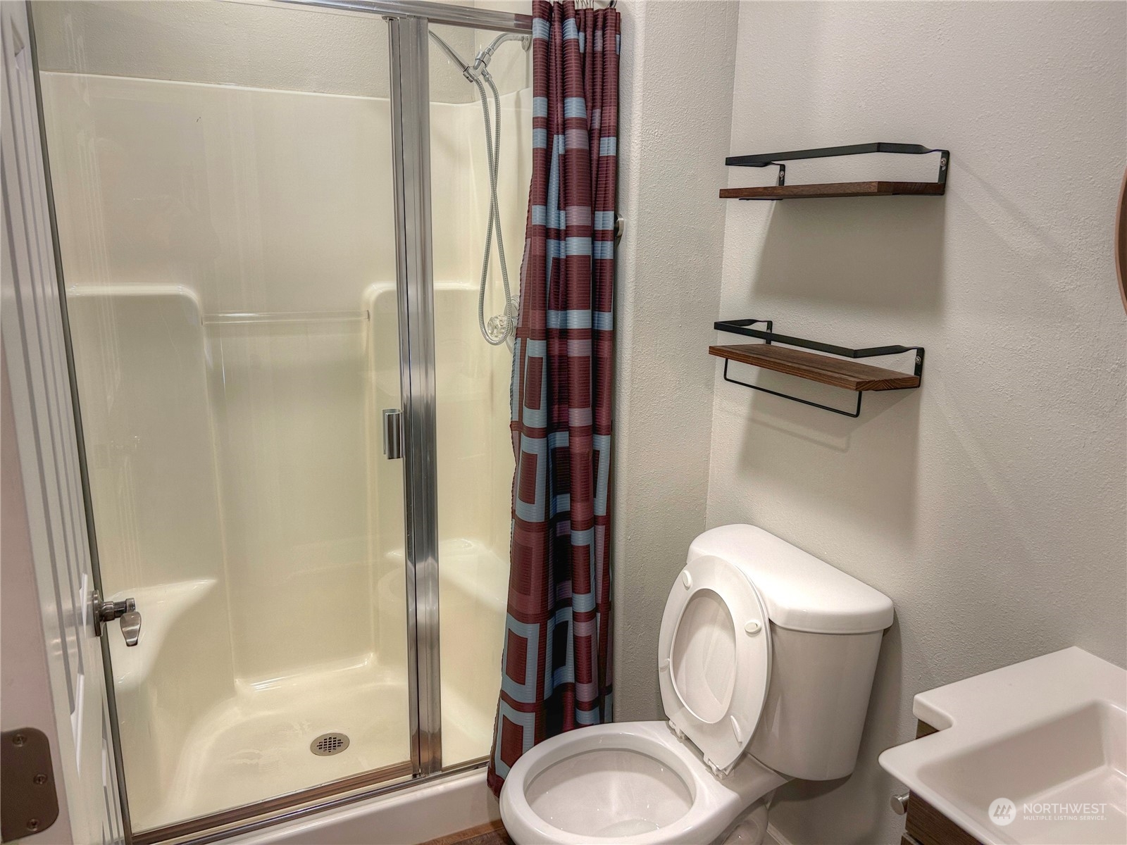 18835 Southeast Petrovitsky Road Renton, WA 98058 - Photo 14 of 34 a bathroom with a toilet and a shower