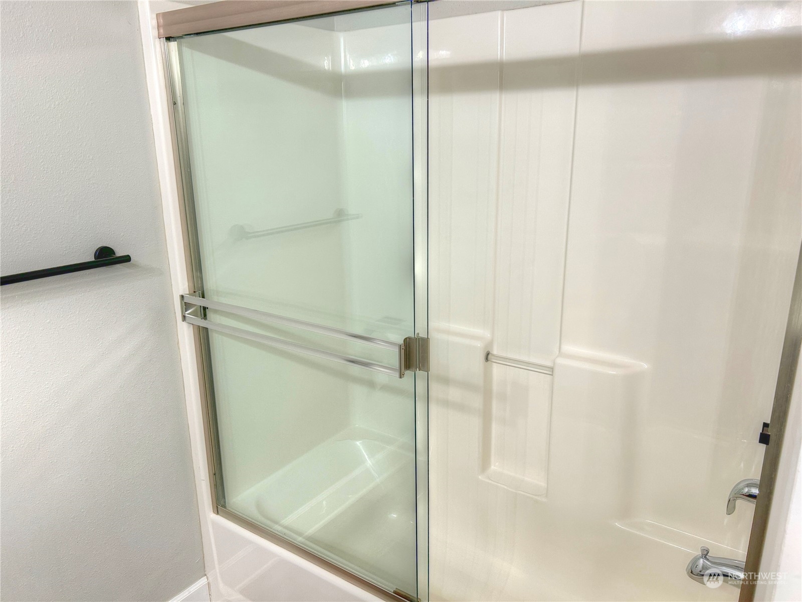 18835 Southeast Petrovitsky Road Renton, WA 98058 - Photo 15 of 34 a bathroom with a glass shower door