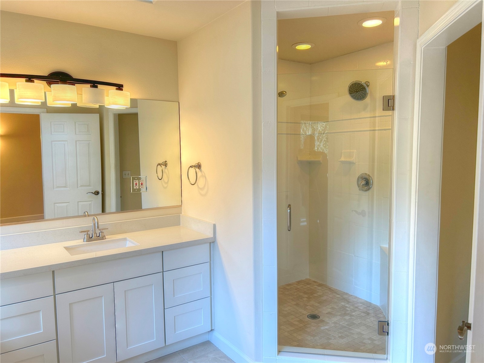 18835 Southeast Petrovitsky Road Renton, WA 98058 - Photo 18 of 34 a bathroom with a shower sink and mirror