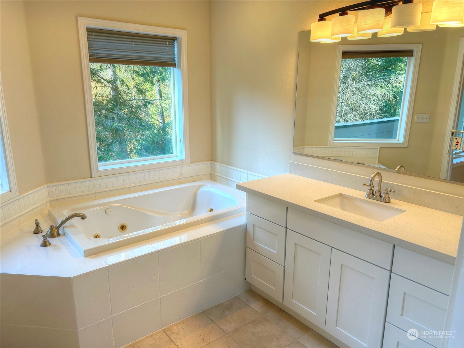 18835 Southeast Petrovitsky Road Renton, WA 98058 - Photo 19 of 34 a bathroom with a tub a sink and a window
