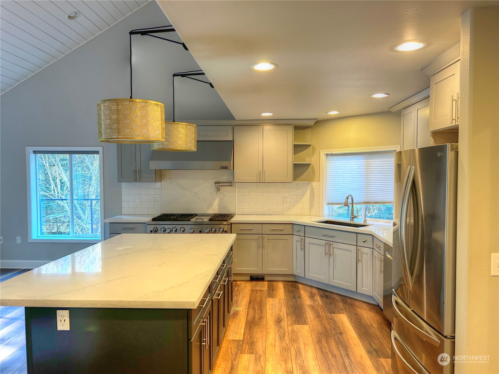 18835 Southeast Petrovitsky Road Renton, WA 98058 - Photo 5 of 34 a kitchen with a sink a stove and a refrigerator