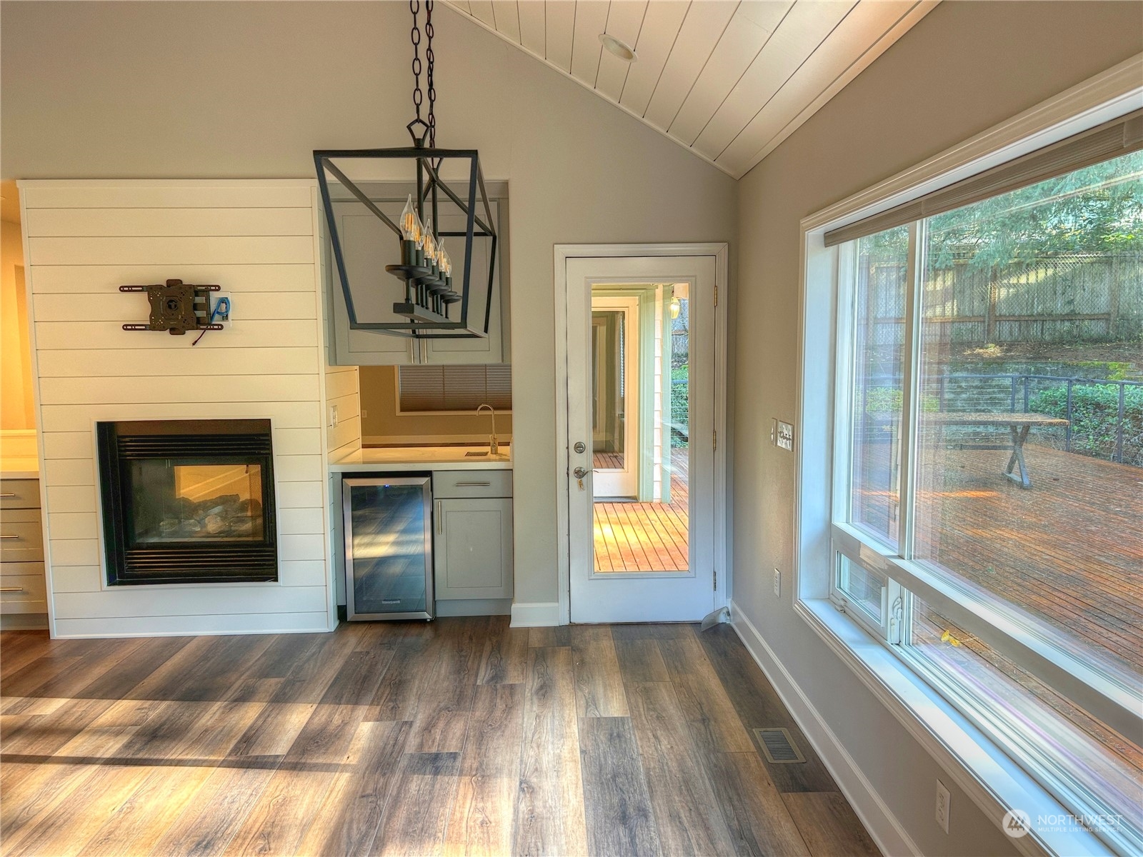 18835 Southeast Petrovitsky Road Renton, WA 98058 - Photo 9 of 34 a view of a livingroom with a fireplace and wooden floor
