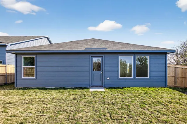 a view of a brick house with a large windows