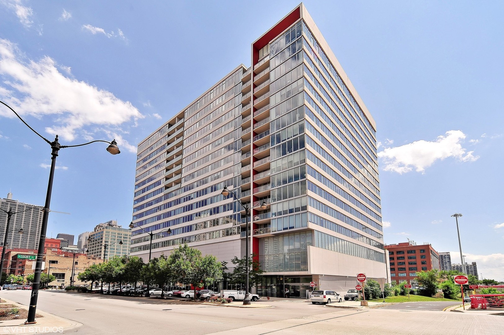 659 West Randolph Street, Unit 1105 Chicago, IL 60661 - Photo 1 of 11 a front view of a building and a street