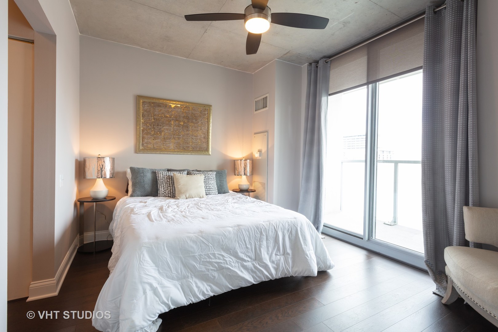 659 West Randolph Street, Unit 1105 Chicago, IL 60661 - Photo 6 of 11 a bedroom with a large bed and a large window