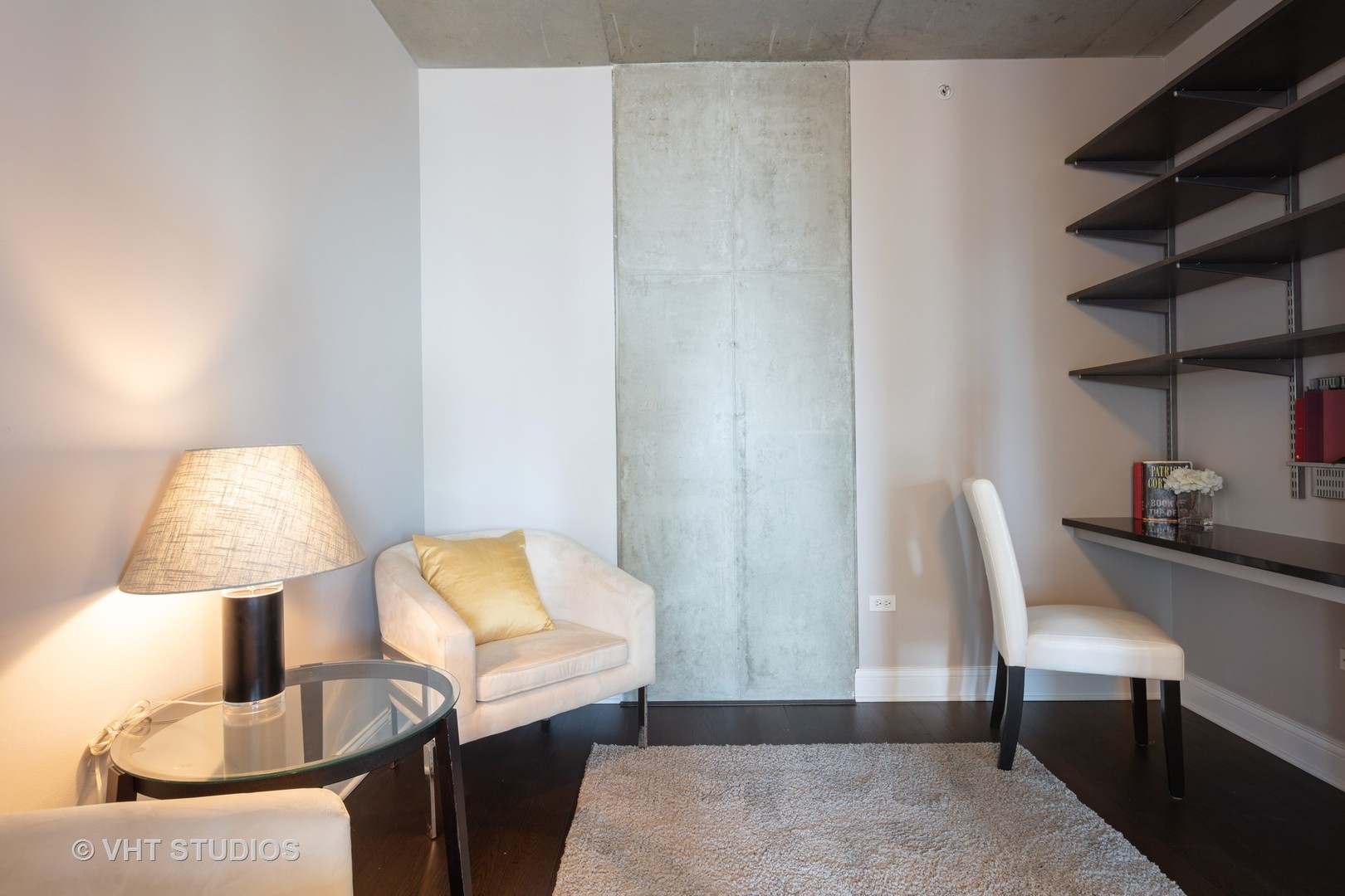 659 West Randolph Street, Unit 1105 Chicago, IL 60661 - Photo 8 of 11 a living room with furniture and a lamp