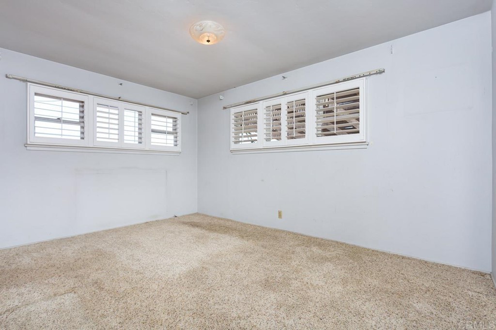 323 Hill Drive Vista, CA 92083 - Photo 20 of 39 an empty room with windows