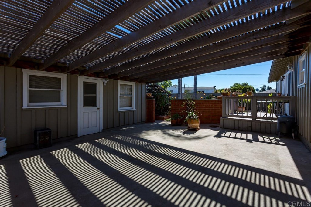 323 Hill Drive Vista, CA 92083 - Photo 27 of 39 a view of a patio with a table chairs and wooden floor