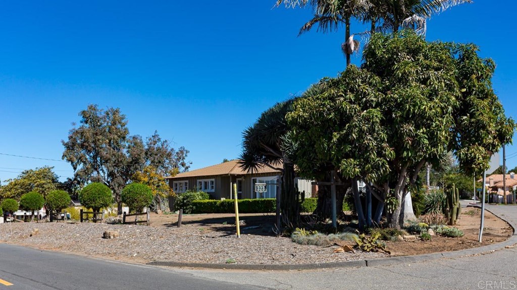 323 Hill Drive Vista, CA 92083 - Photo 5 of 39 a front view of a house with a yard