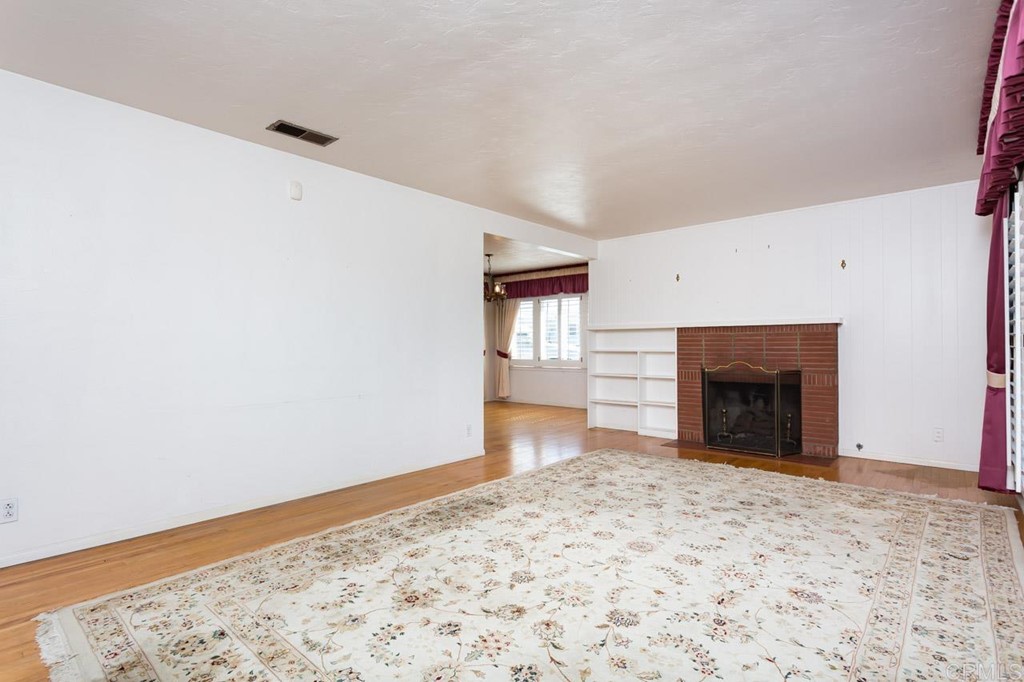 323 Hill Drive Vista, CA 92083 - Photo 7 of 39 a view of empty room with a fireplace
