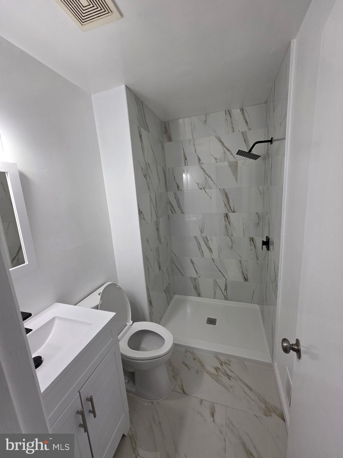 7005 Nightingale Terrace Lanham, MD 20706 - Photo 12 of 23 a bathroom with a sink a toilet and shower