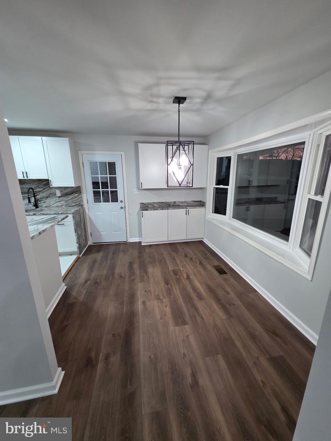 7005 Nightingale Terrace Lanham, MD 20706 - Photo 17 of 23 a view of a room with wooden floor fireplace and window
